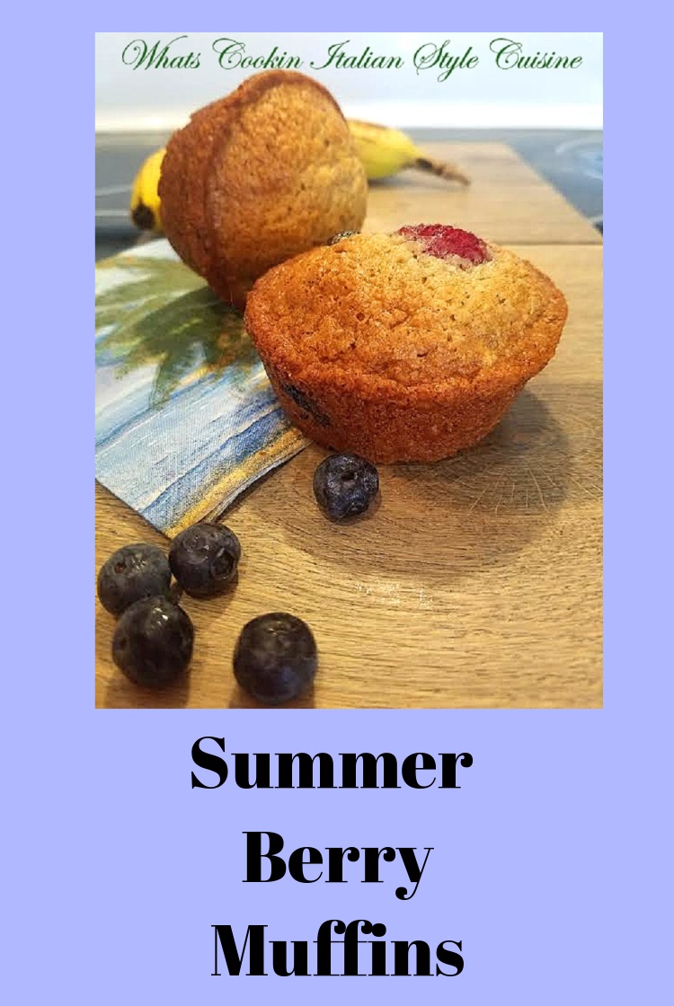 these are Summer Berry Muffins are a quick bread with banana, raspberries and blueberries. Golden brown sweet muffins with fresh fruits and on a tropical palm tree plate