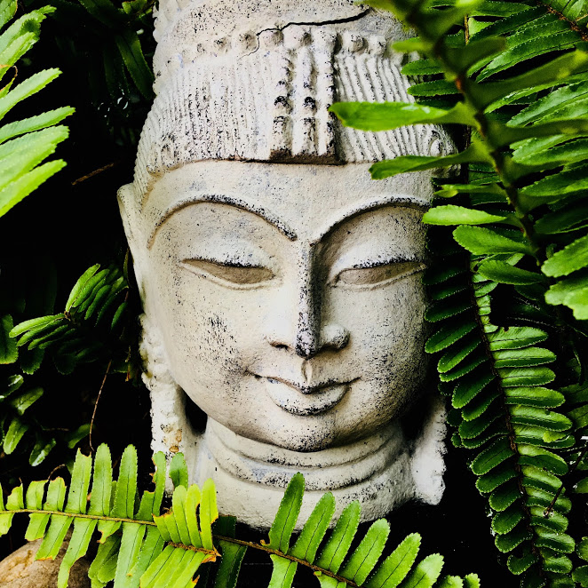 Small Buddha Head Bust at a Family front yard 