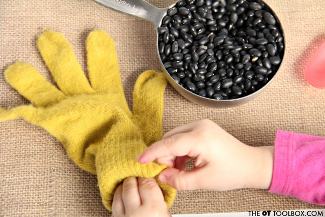 weighted fidget toy for kids at home or school Use a knit glove to make a weighted and calming fidget toy for kids