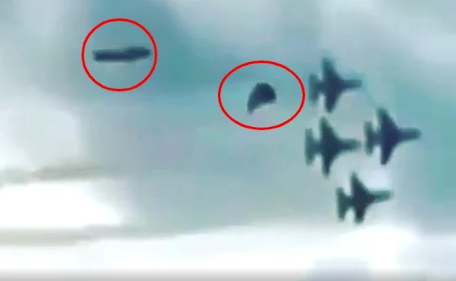 Two-UFOs-following-behind-a-US-Air-Force-Jet-formation.