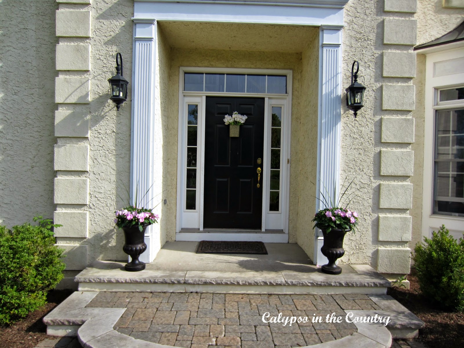 Spring Front Porch Spring Front Porch with Black Urns