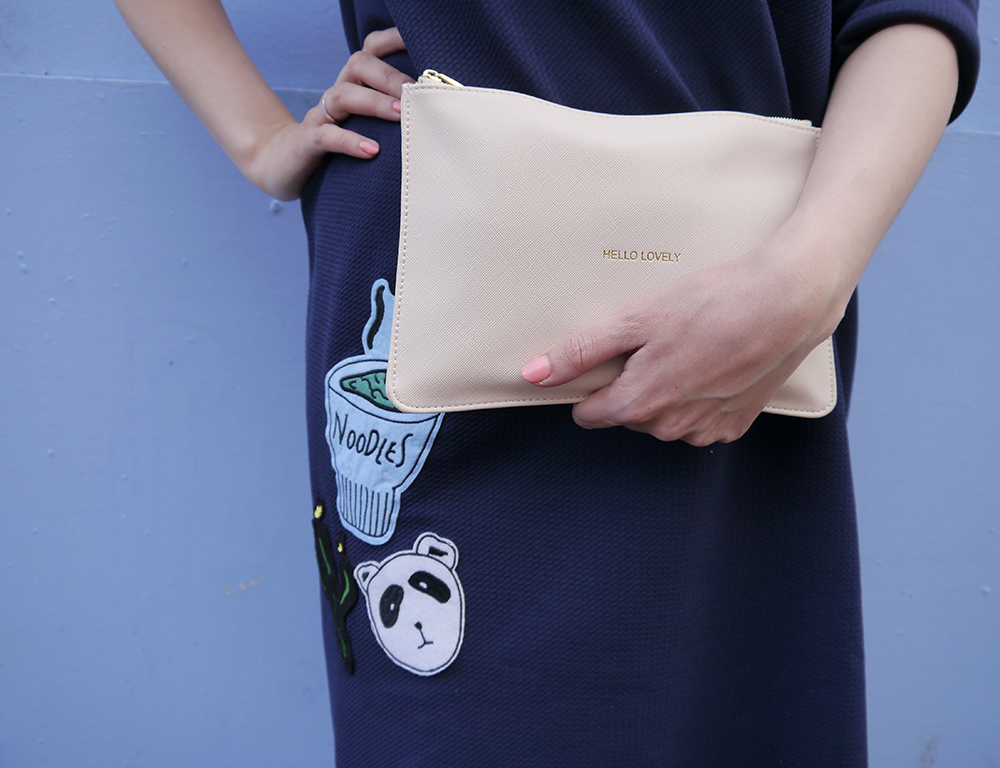 katie loxton hello lovely pouch bag as worn by UK blogger wardrobe conversations blue outfit, oversized slouchy dress, modern fashion silhouette, uk style blogger, wardrobe conversations, sew on patch, the whitepepper,