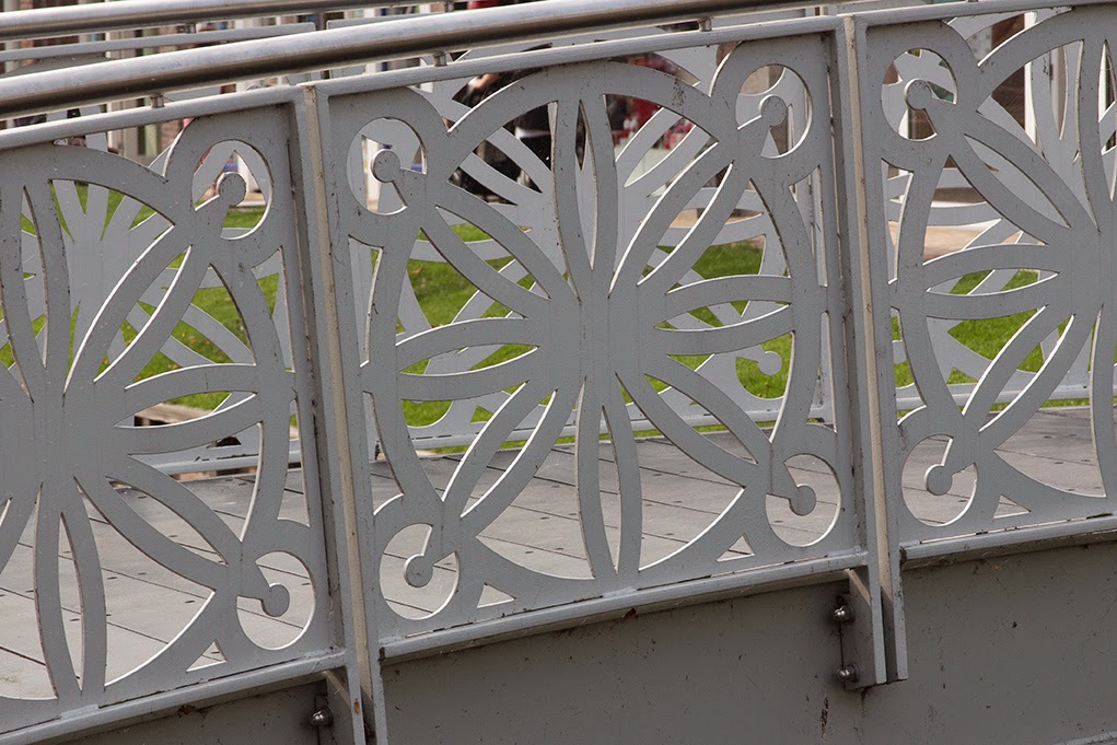 white patterned railing of bridge