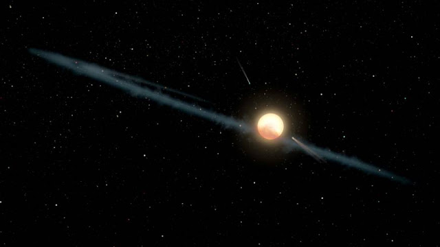 An illustration depicts a hypothetical uneven ring of dust orbiting Tabby's Star. | REUTERS