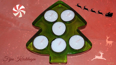 Kerstboom met waxinelichtjes er in