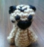 http://www.ravelry.com/patterns/library/pug-finger-puppet-2