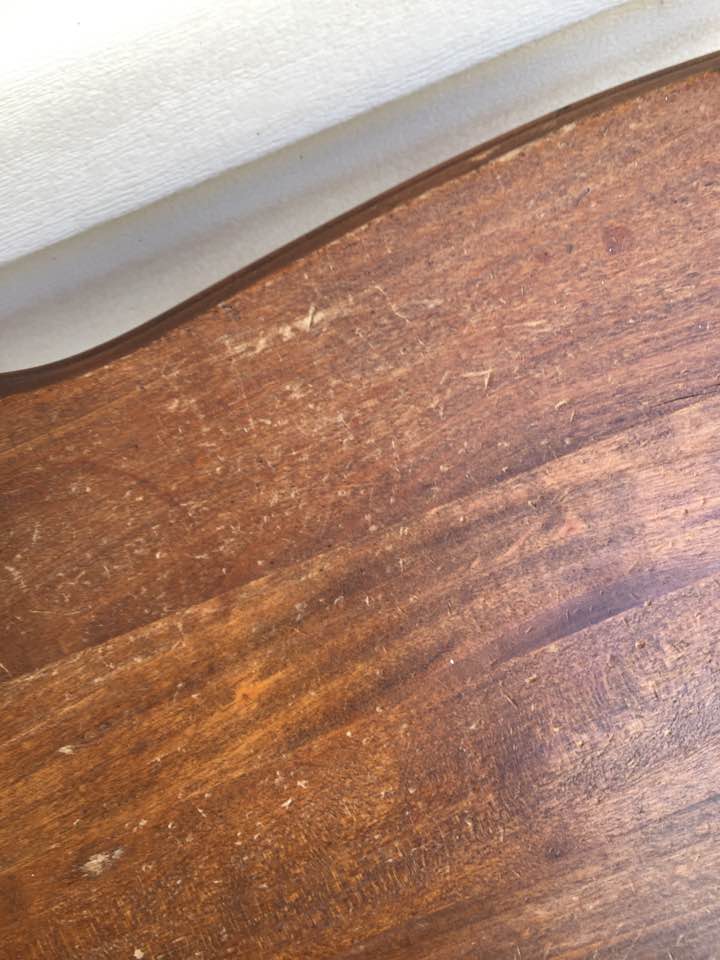 Pits and scratches in wood table top. Pits and scratches in wood table top.