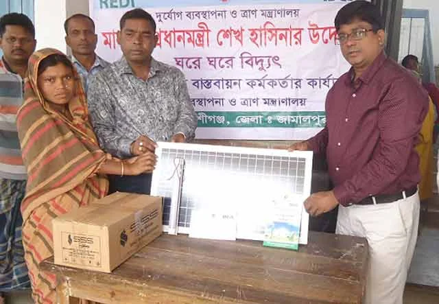 Solar panels distributed among the poor people in Bakshiganj