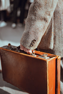 Leather Suitcase Photo by Clem Onojeghuo on Unsplash