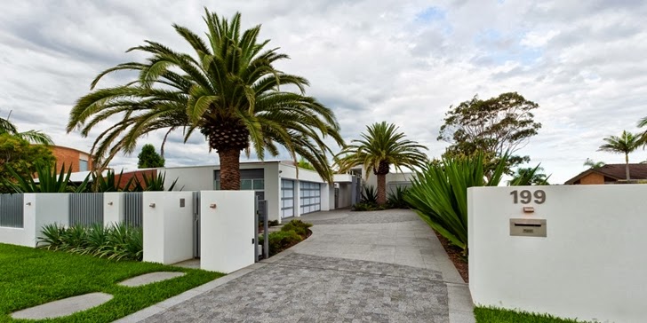Property gate in Coastal Oasis landscape project by Urban Exotic