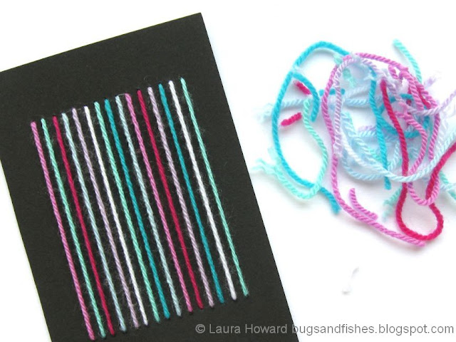 Handmade card decorated with lines of yarn