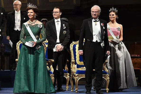 Queen Silvia, Prince Daniel, Prince Carl Philip. Princess Sofia wore a red dress. Crown Princess Victoria wore her mother's gown