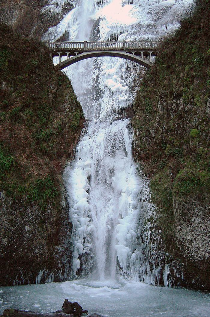 Multnomah Falls is a waterfall on the Oregon side of the Columbia River Gorge, located east of Troutdale, between Corbett and Dodson, along the Historic Columbia River Highway. The falls drops in two major steps, split into an upper falls of 542 feet (165 m) and a lower falls of 69 feet (21 m), with a gradual 9 foot (3 m) drop in elevation between the two, so the total height of the waterfall is conventionally given as 620 feet (189 m). Multnomah Falls is the tallest waterfall in the State of Oregon. It is credited by a sign at the site of the falls, and by the United States Forest Service, as the second tallest year-round waterfall in the United States. However, there is some skepticism surrounding this distinction, as Multnomah Falls is listed as the 137th tallest waterfall in the United States by the World Waterfall