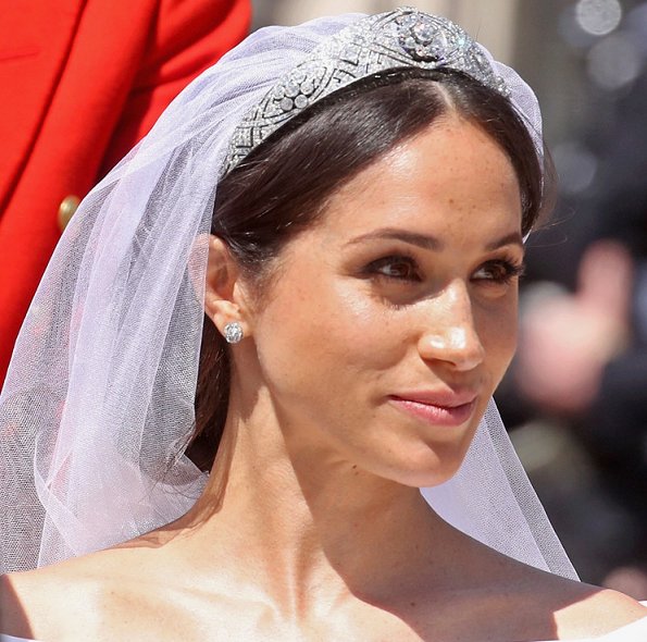 Markle wore a silk organza boat neck long sleeve wedding dress designed by famous British designer Clare Waight Keller.