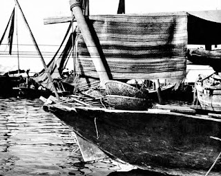 Coracle on a Vietnamese fishing junk, early 1960s