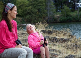 A mother and daughter having a good time outdoors. A mother and daughter having a good time outdoors.