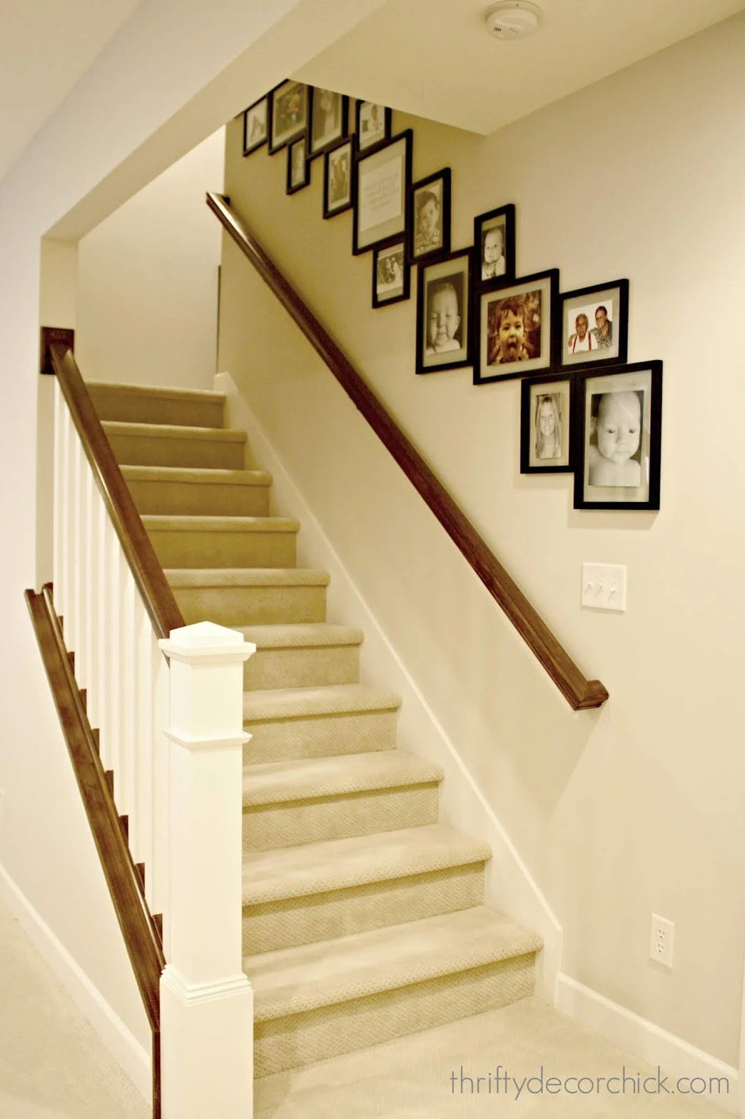 Gallery wall that goes down the stairs