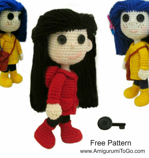 crochet doll with red coat and boots