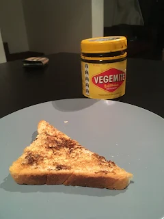 Serving of Vegemite on buttered toast