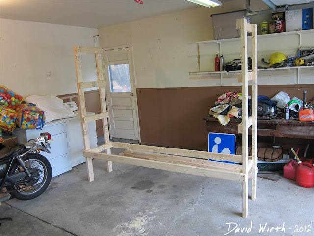half way through building wood shelf, organize garage