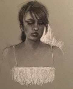 Charcoal drawing of woman Charcoal drawing of woman in a white sundress looking down drawn on dark blue paper