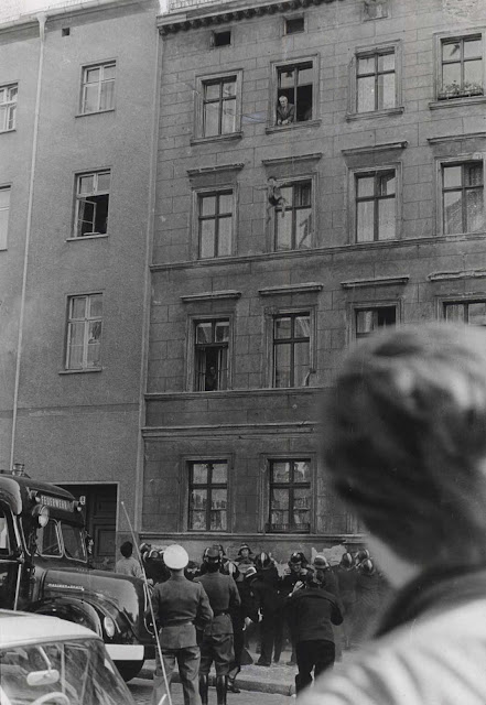 Four-year-old Michael Finder escaping communism from a window. October 7, 1961.