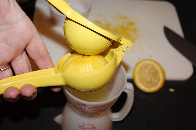 Squeezing Lemons for Fresh Lemon Juice Image