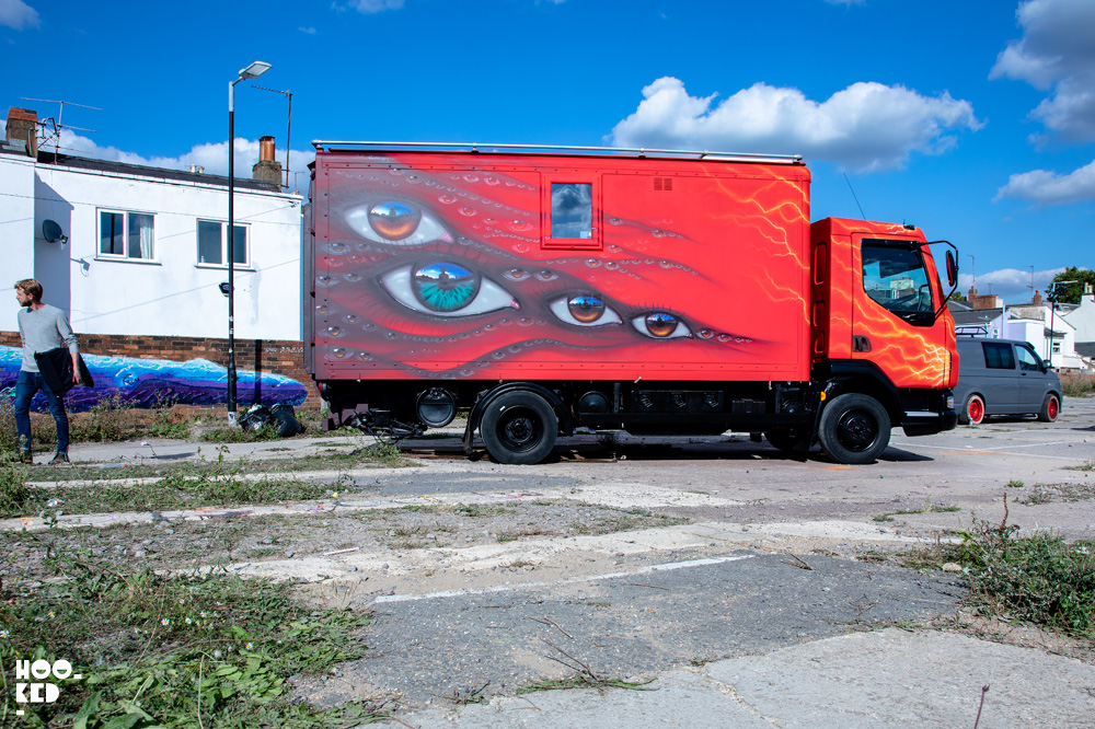 Final images of red van decorated with eyes by Street Artist My Dog Sighs