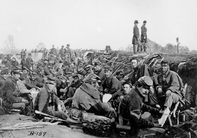 Soldiers of the VI Corps, Army of the Potomac, in trenches before storming Marye's Heights at the Second Battle of Fredericksburg during the Chancellorsville campaign, Virginia, May 1863. This photograph (Library of Congress #B-157) is sometimes labeled as taken at the 1864 Siege of Petersburg, Virginia.