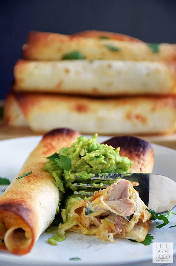 Slow Cooker Chicken Taquitos | by Life Tastes Good is very easy to make any night of the week. The creamy, cheesy filling with just the right amount of spiciness all wrapped up in a crunchy tortilla makes this one of my very favorite slow cooker meals.