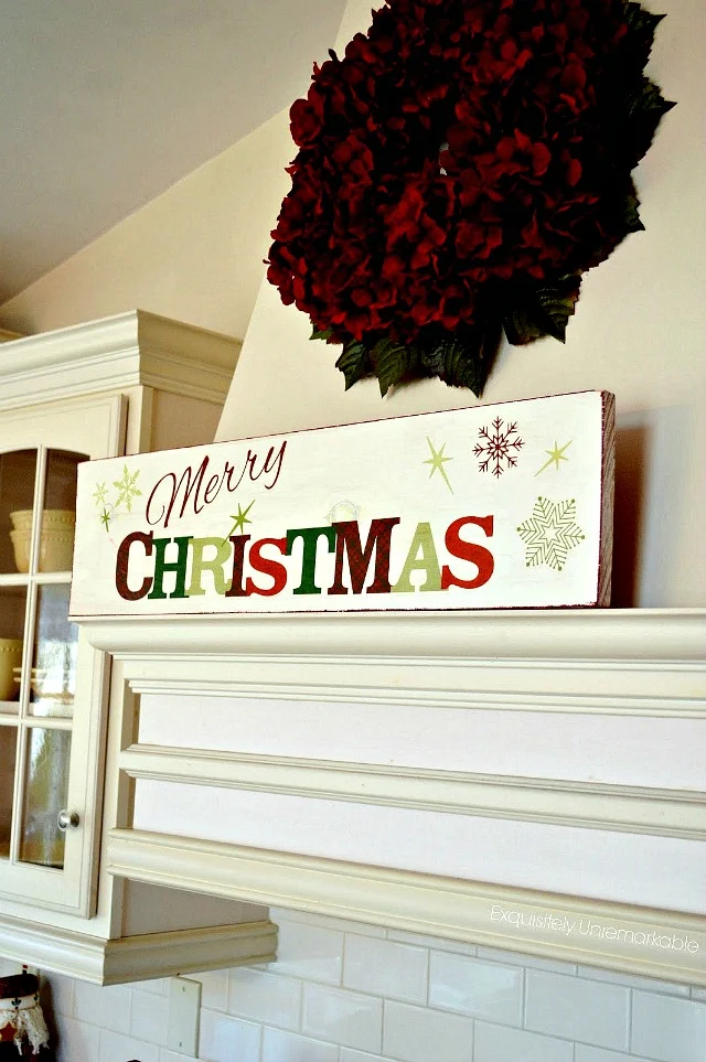 Merry Christmas Wooden Sign on the kitchen hood