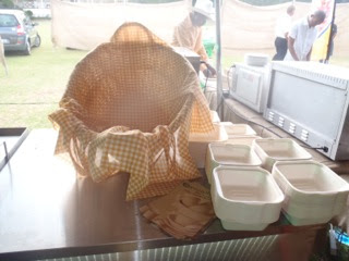 Biodegradable bagasse takeaway clamshells on a market stall counter