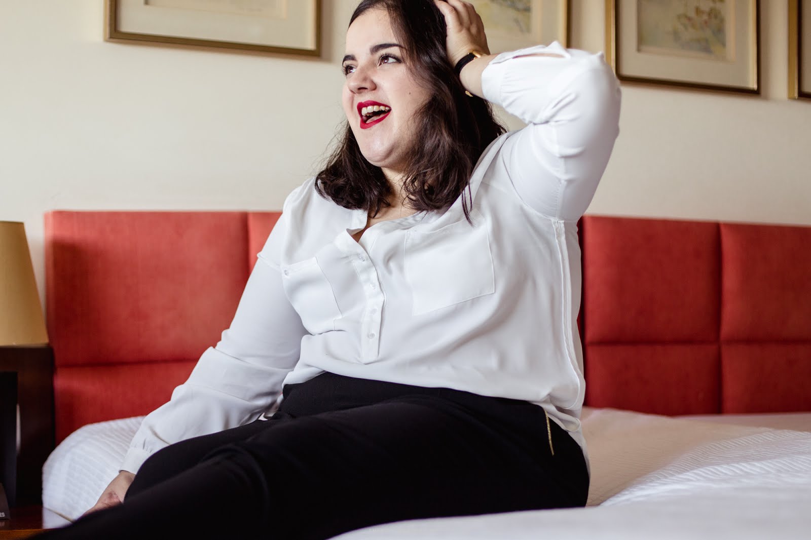 White blouse, black slacks and a golden detail watch outfit.