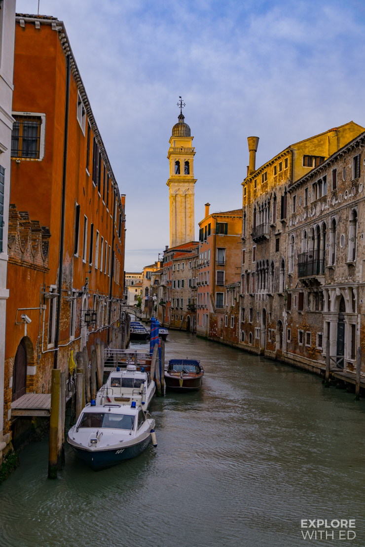 1 of the 170 canals of Venice lined with colourful buildings and historical churches