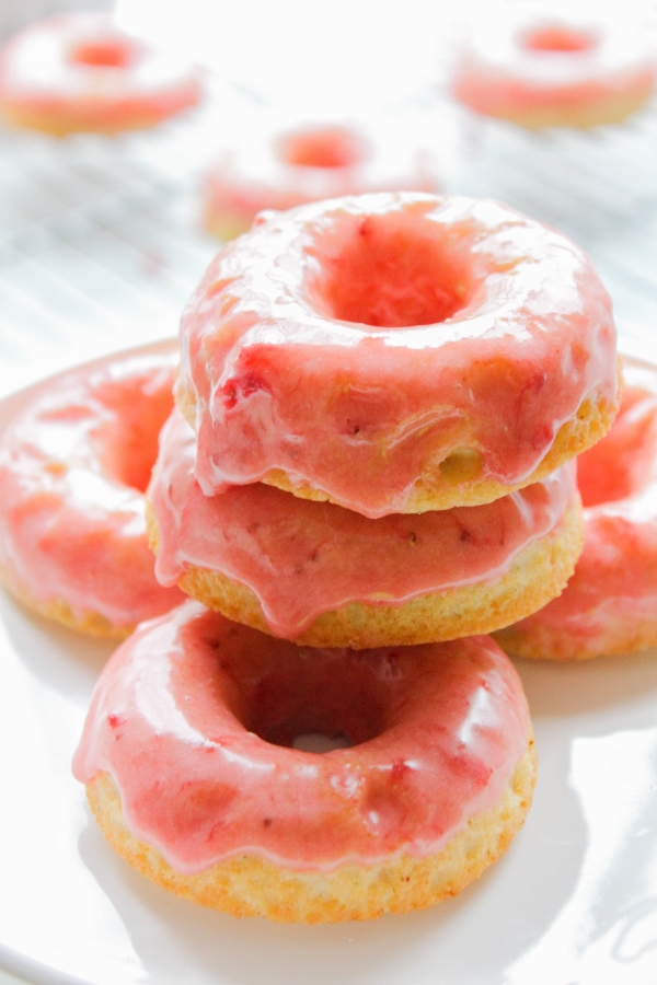 These cardamom donuts are light and fluffy, baked not fried, and topped with a simple and sweet strawberry frosting. They are perfect for spring!