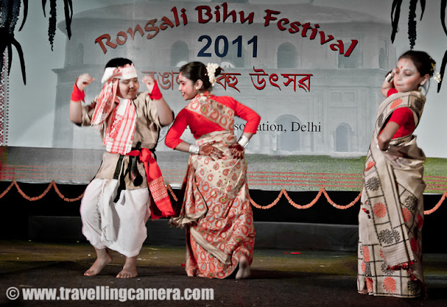 A Marvelous dance performance by troop of lovely school children on Bihu songs @ Rogali Bihu Festival at Indira Gandhi National Center of Art (24th April, 2011) : Posted by VJ SHARMA on www.travellingcamera.com : Recently I witnessed Rogali Bihu Festival at Indira Gandhi National Center of Art which was organized Assam Organization, Delhi !!! among various Bihu performances, these children presented a shining dance performance with cute expressions at each step... Check Out !!!Smallest girl in the troop and was leading one side of the sub-group on stage.. She was really enjoying dance with amazing expressions on her face and I assume expressions were changing as per the lyrics of the song !!! I am not sure because I could not understand Assamese...While other performances were going on the stage, these kids were roaming around the stage and it seemed that limit of their wait has crossed !!!Enthusiasm of all the kids was unmatchable and till the end they were like that only !!!If I am not missing anything, there were only two boys surrounded by all the girls !!! During the end part, a boy dressed up as old man entered and performance finished after some conversations between the lead person on the stage and the old man !!!These children look so pretty in Assamese sari's. This girl's smile reminds me of Vayjanthimala.Cute group of School children performing Bihu dance in sync @  Rongali Bihu Festival in Delhi, INDIA !!For such a sustained and consistent performance, these children would have had to go through several hours of practice. Kudos to them and their teachers for the achievement.Somehow synchronization is always a challenge with child dancers but that adds to the innocense of it all.Some steps were fairly complicated but the children were obviously enjoying themselves to the core.It was all done with the intention of having fun as well as performing for an audience.Saris were similar yet not the same. Some performers were obviously younger than the others. Yet age did not seem to make much difference to the quality of performances.Expressions were mature and could very well have been used in a drama. I don't know what the song was saying but it was easy to make out the gist from the expressions of these dancers cum actors.This seems to be a common step in this form of dance. Almost all performances included this.Highly enthusiastic and energetic performance by children. They were the life of the party.I hope these children keep performing and help in keeping the traditional dances alive. Preserving culture is very important. It is what gives each community its unique identity.