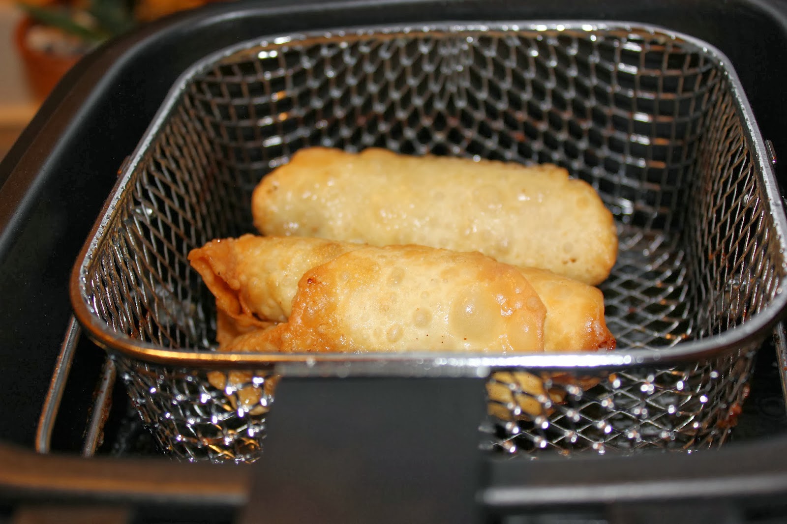 A busy working woman finds time to cook steak and cheese egg rolls