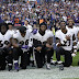 American football stars defy Trump by dropping to their knees during US national anthem