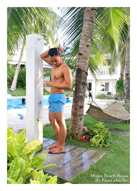 Getting a shower before dipping to the pool Getting a shower before dipping to the pool