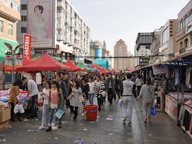people walking on a pedestrian street in Mudanjiang, China