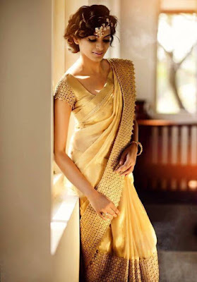 Custom border on a gold bridal silk saree with match color blouse design is simply perfect.