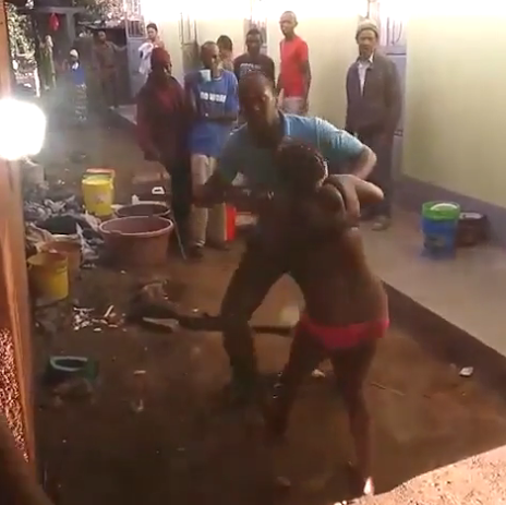 000 Photos: Neighbours stand and watch as man beats his wife almost to death for cheating