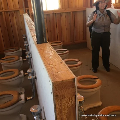 toilets in women's latrine at Manzanar National Historic Site in Independence, California