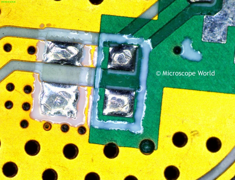 Printed circuit board under microscope at 30x.