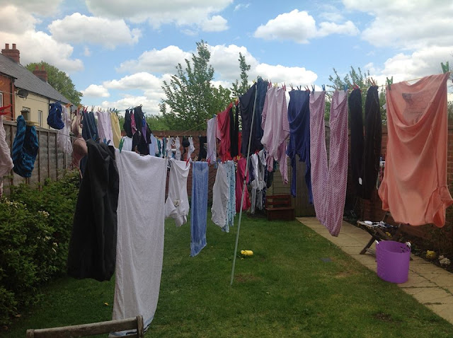 Many washing lines, criss-crossing a small lgarden
