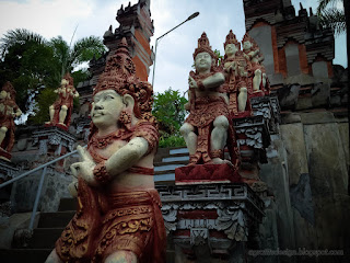 Balinese Style Statues On The Edge Of The Stairs Of Gate Entrance At Buddhist Monastery In Bali Indonesia