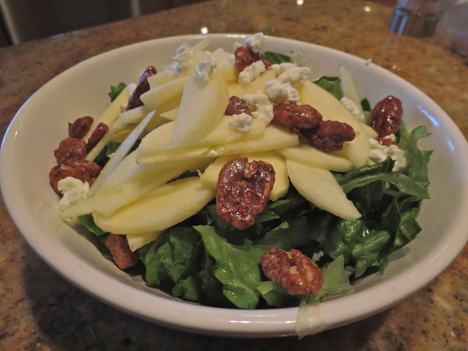 The Bee Cave Kitchen Spinach salad with apples, candied pecans and