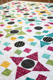 Game Night quilt pattern found in the Fresh Fat Quarter Quilts book by Andy Knowlton of A Bright Corner - a bold, bright, modern quilt with applique circles