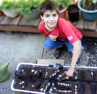 Organic Gardening Education with Kids - The process of forming irrigation canals.