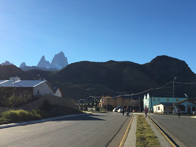 Patagonia: Like Falling in Love. wide boulevards into El Chalten overlooked by Mount Fitzroy wide streets leading to foot of snow-capped mountains